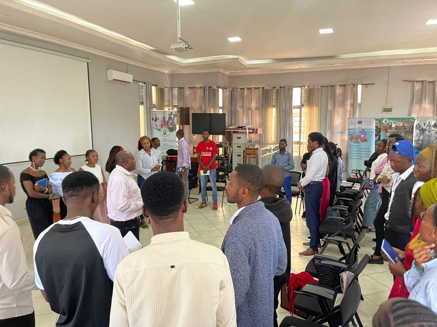 Participants in a standing circle