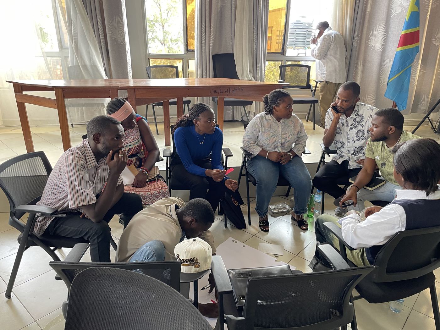 Dialogue workshop participants discussing in a circle