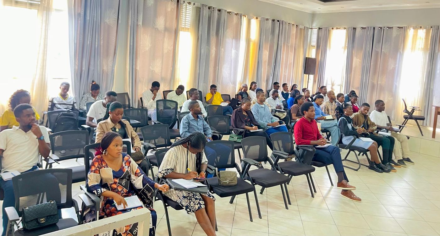 Participants taking notes during a training session